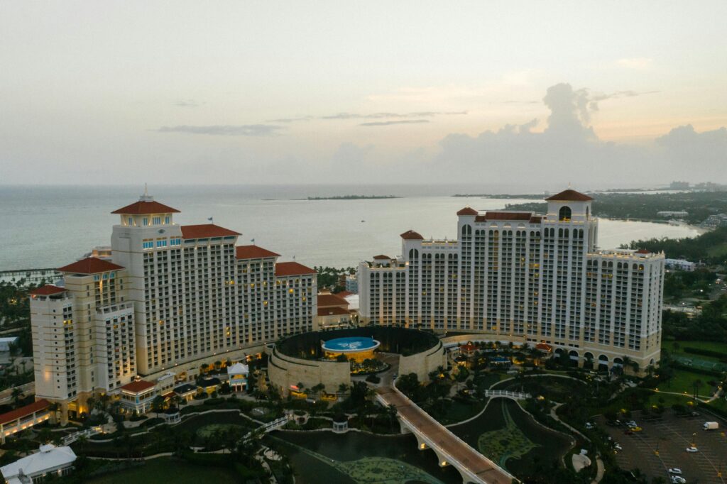 Hyatt Luxury Hotel Experience Explore the serene aerial view of a stunning coastal resort at dusk, capturing the essence of a tranquil getaway.
